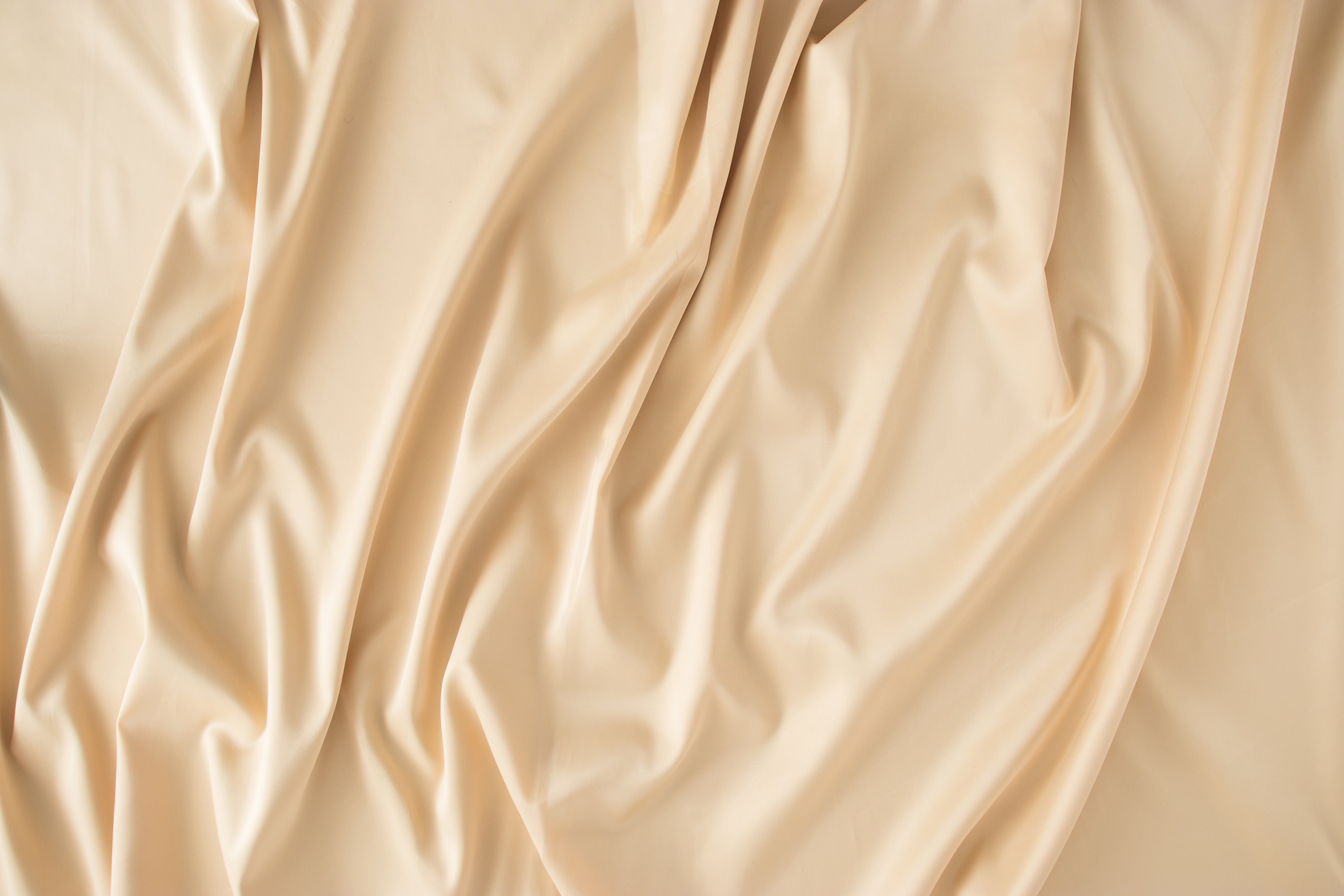 Beige light brown silk sheet. Minimal concept. Flat lay